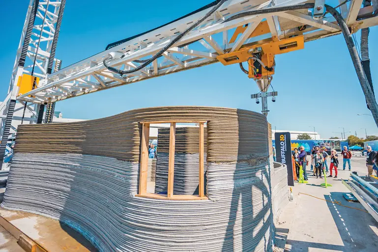 3D printer on construction site building a house