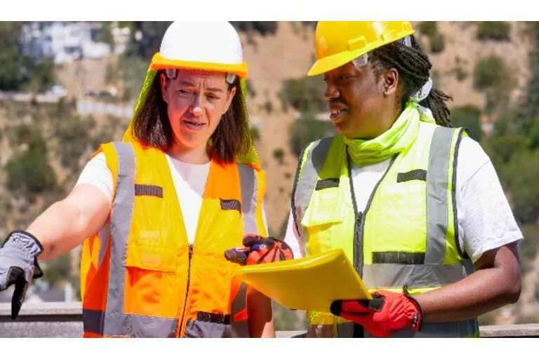 Two women having construction meeting onsite