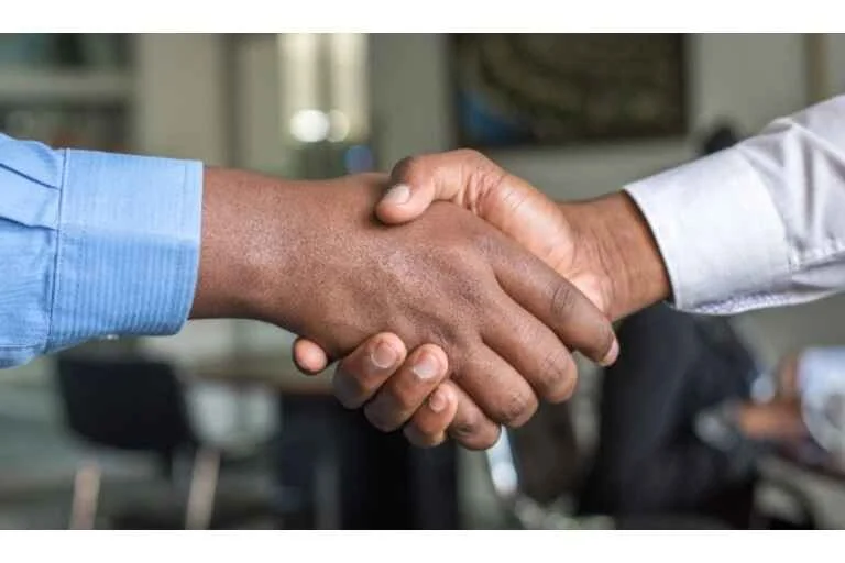 Two people shaking hands