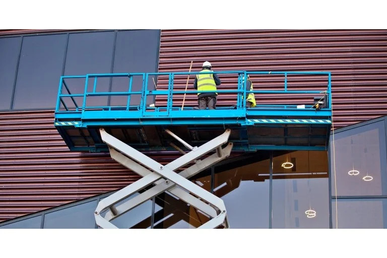 Man on scissor lift