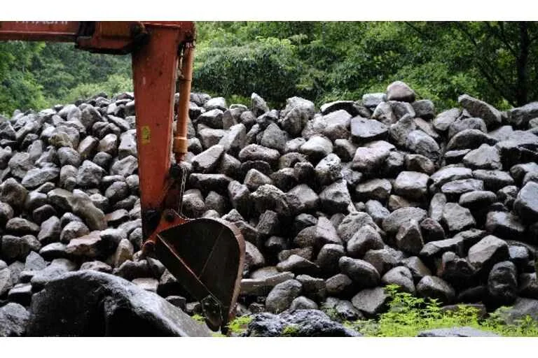 Digger moving rocks