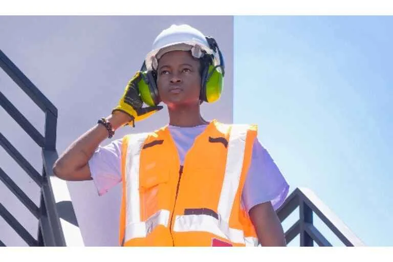 Female construction worker wearing ear defenders 
