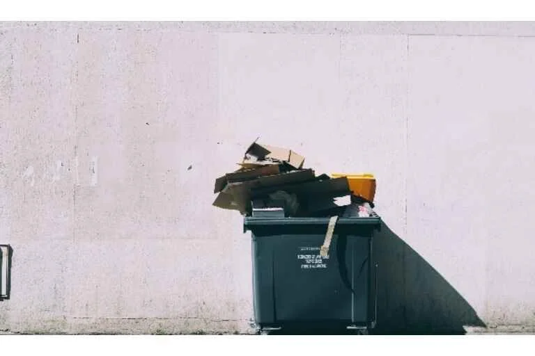 Overflowing rubbish bin