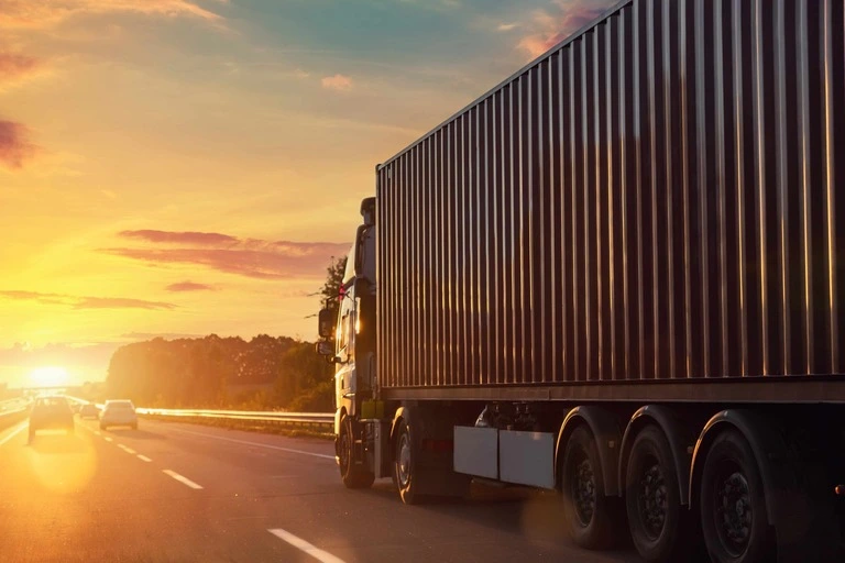 Haulage Van Driving on Motorway into the Sunset