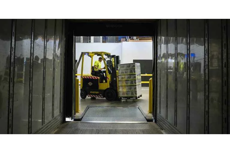 Forklift carrying boxes