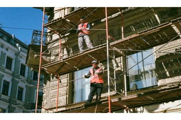 Two men on scaffolding