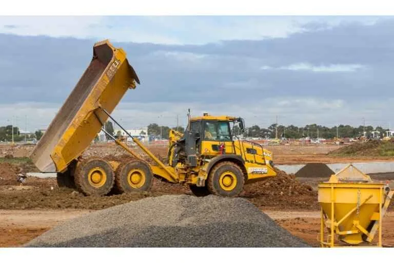 Tractor offloading material
