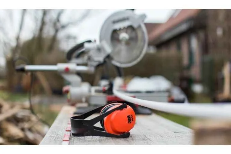 Ear defenders laid on wooden board