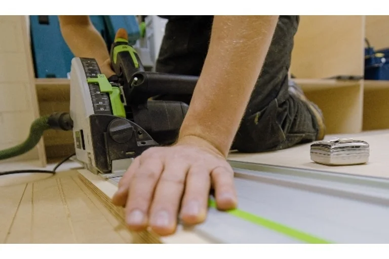Person using plunge saw