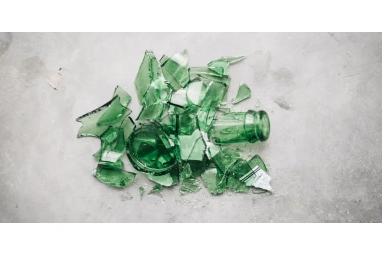 Smashed green glass bottle