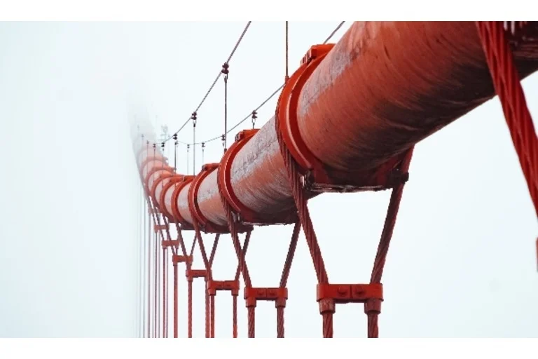 Red Pipeline Bridge in the clouds
