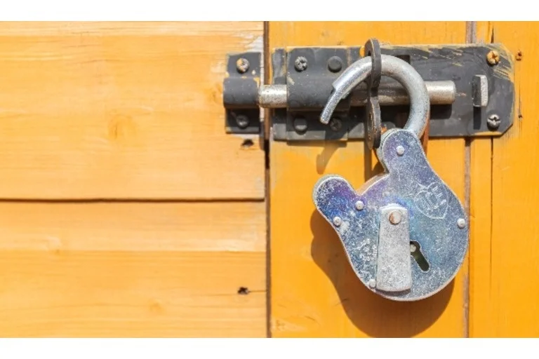 Padlock on wooden door