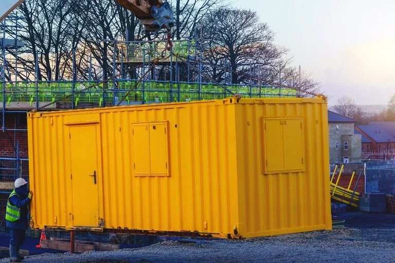 Builder Installing Site Office Cabin Container Welfare Facilities.