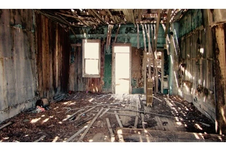 Wooden building falling down