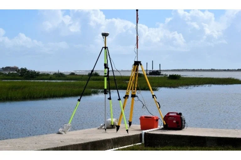 Yellow and green laser levels on tripods